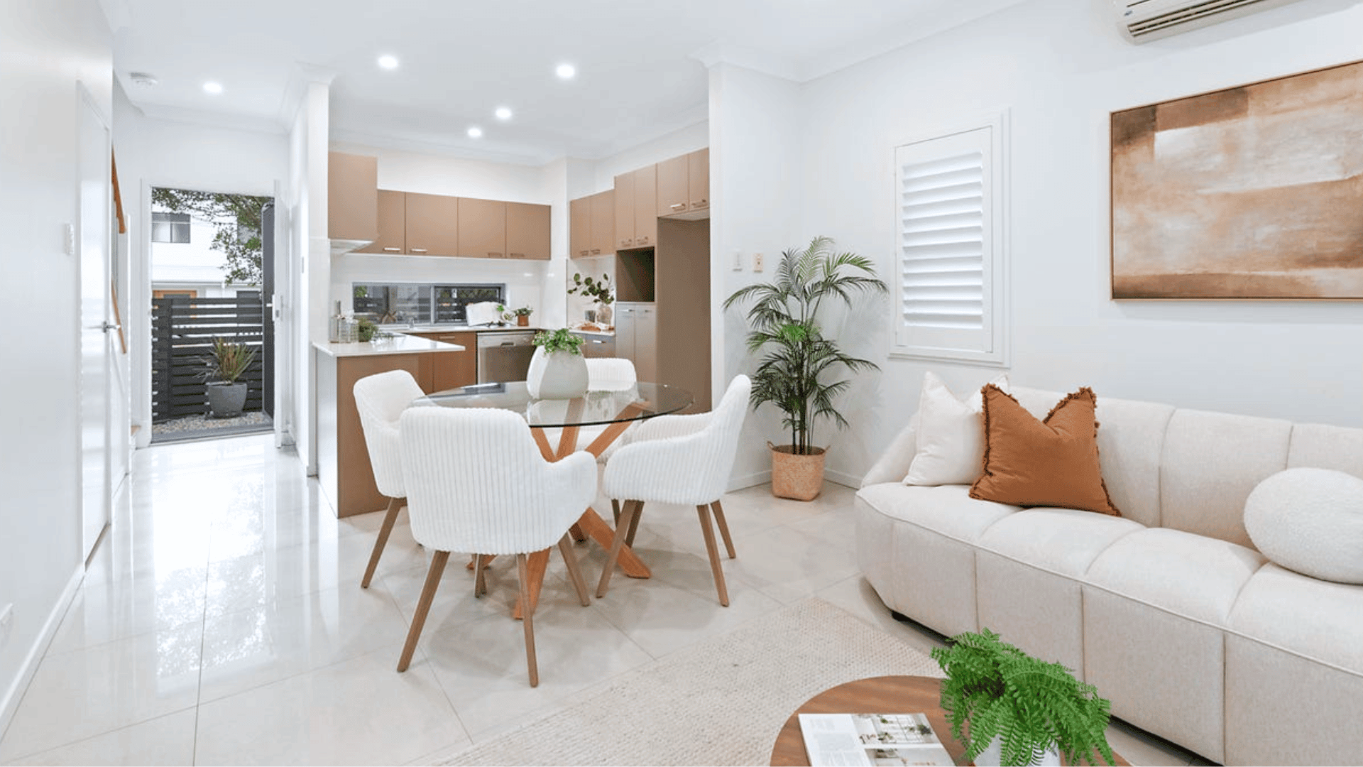 Bright furnished living and dining area in a contemporary investment property